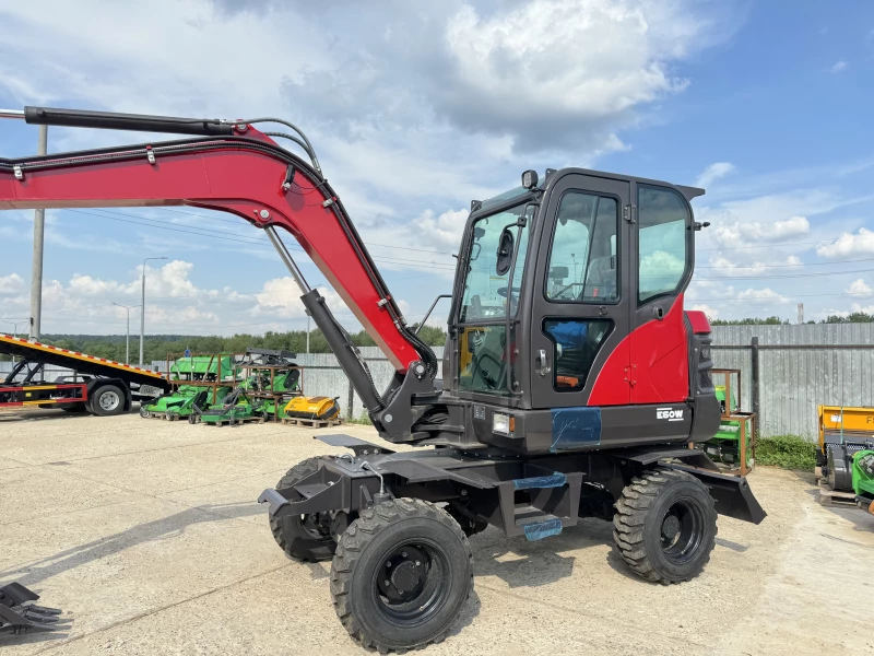 Мини-экскаватор QUADTRAC E60W (6 т, кабина, А/С, квикаплер, поворотная стрела, траншейный ковш)