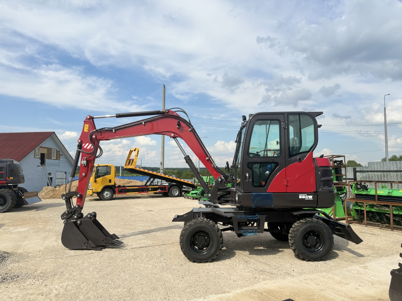 Мини-экскаватор QUADTRAC E60W (6 т, кабина, А/С, квикаплер, поворотная стрела, траншейный ковш)